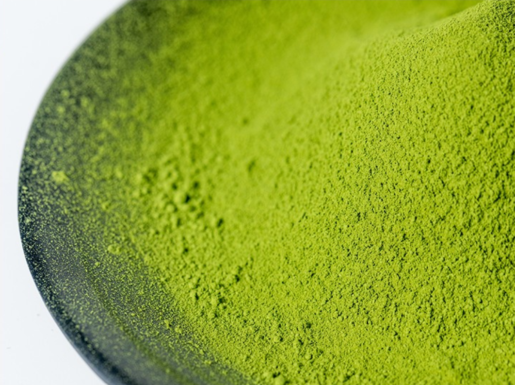 Close-up of green matcha powder in a bowl
